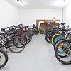 Bike storage room with bikes and bikeracks

