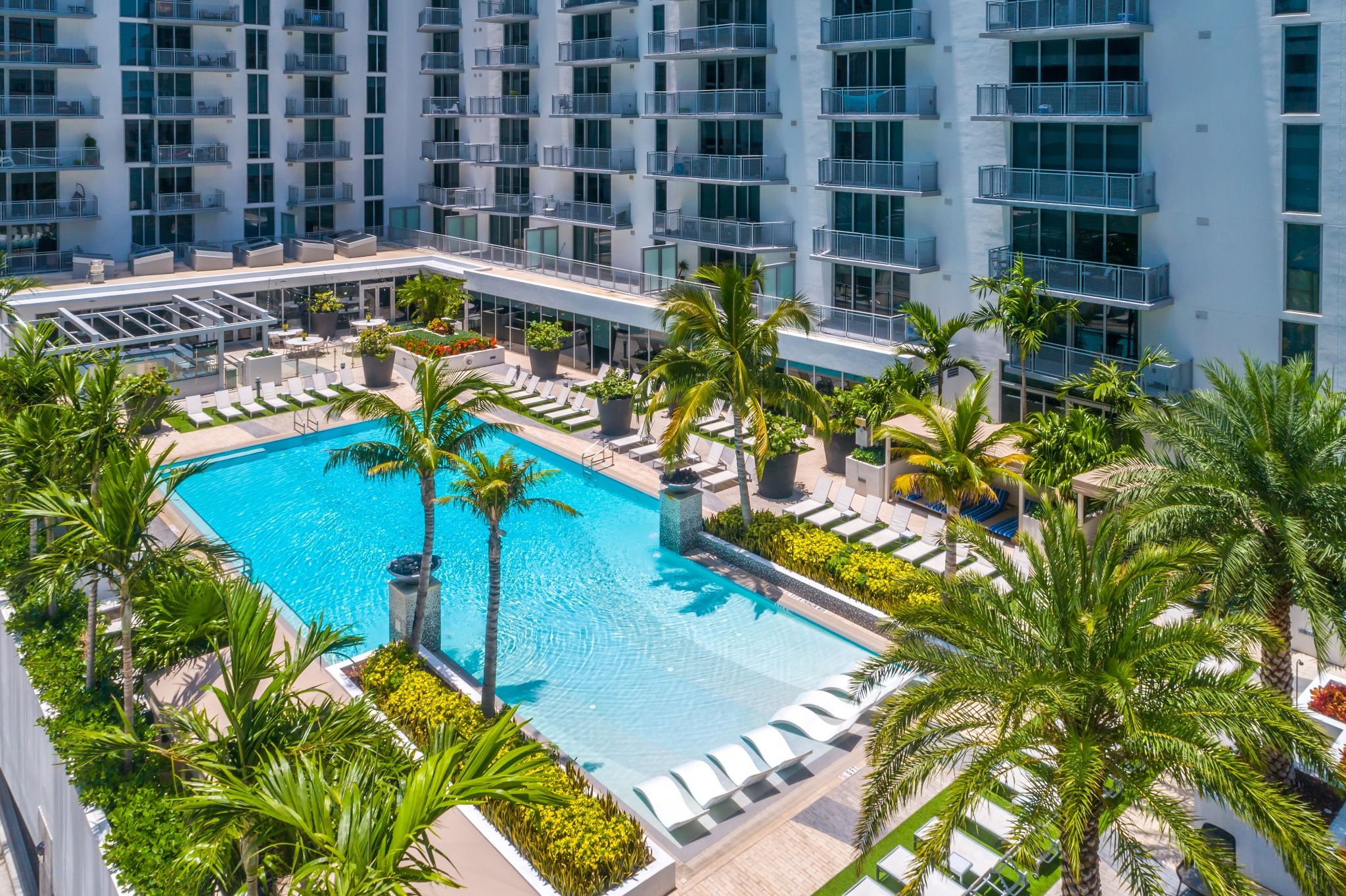 Luxury, Comfort, and Convenience An aerial view of a pool area in Monarc Apartment
