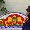 World Class Art & Culture woman in hat near tiled fountain