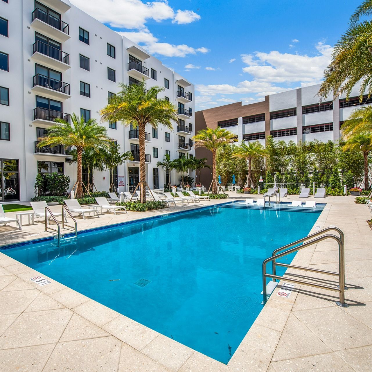 Swimming Pools Luxurious pool courtyard at Villa Solé at SoLé Mia Apartments in North Miami