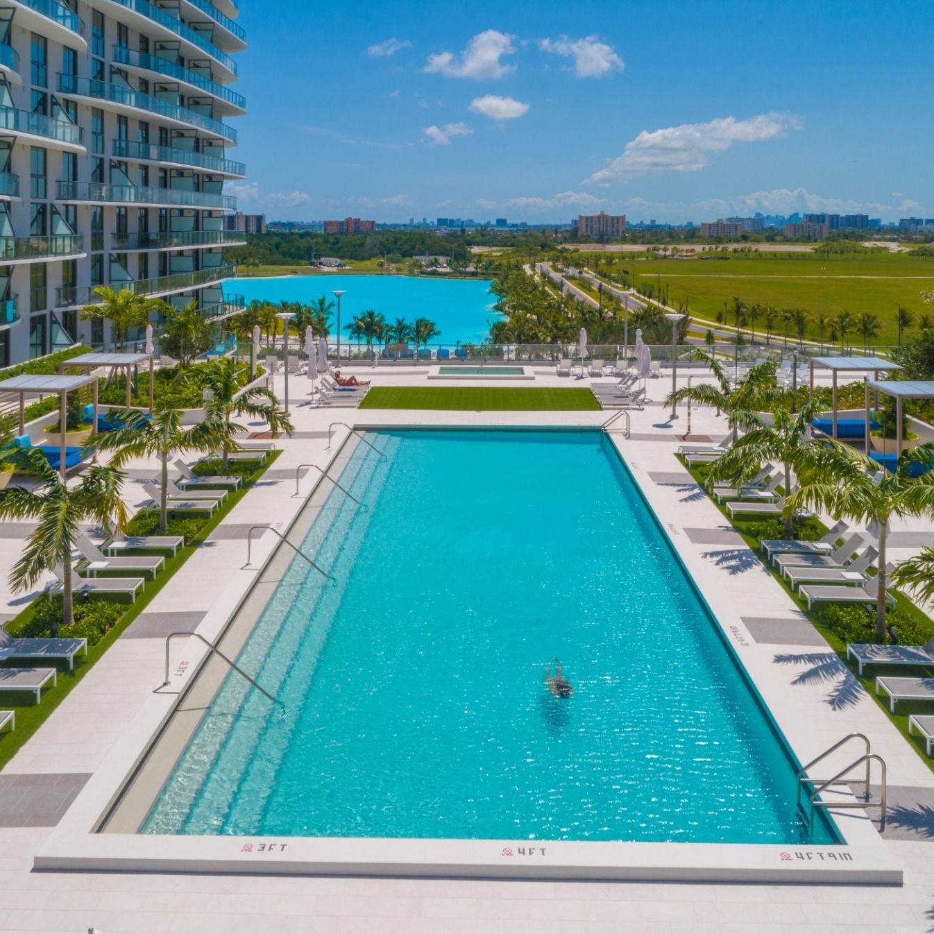 Swimming Pools Elevated pool deck overlooking Laguna SoLé at The Shoreline at Solé Mia Apartments in North Miami
