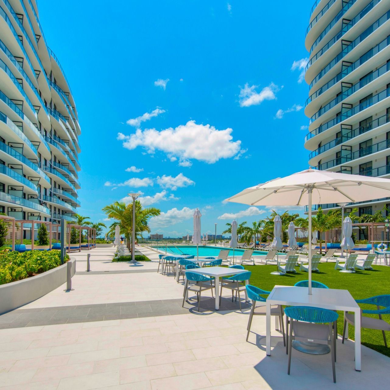 Swimming Pools Outside Dining Area by the Pool  at The Shoreline at SoLé Mia Apartments in North Miami