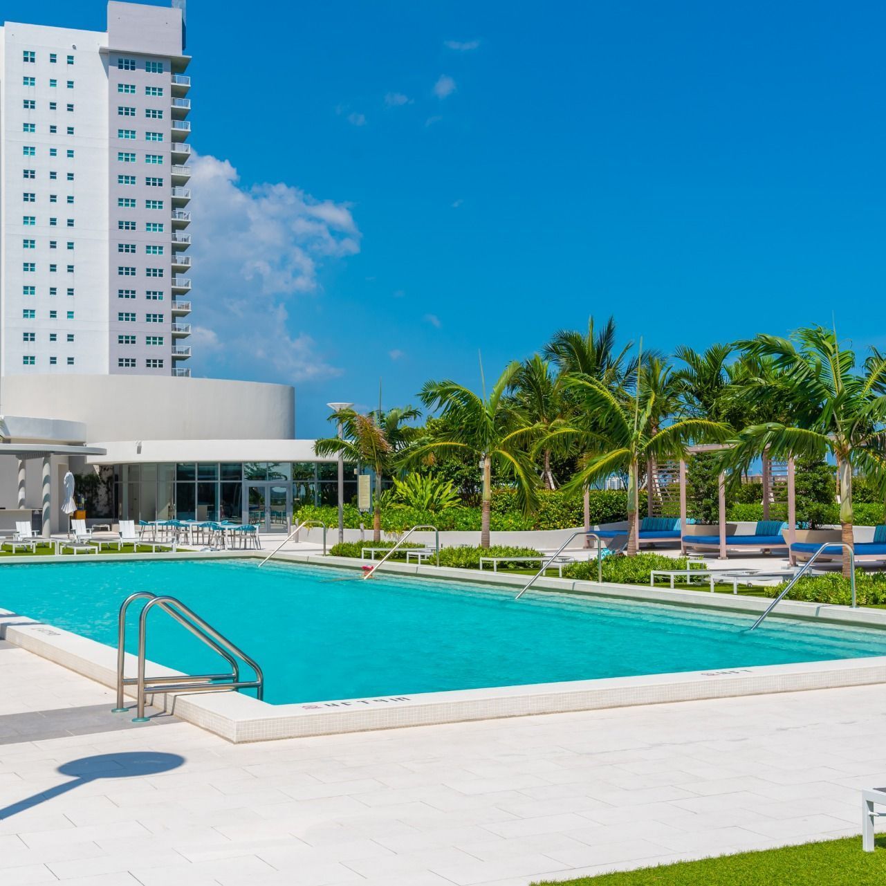 Swimming Pools Pool deck at Shoreline with trees in background