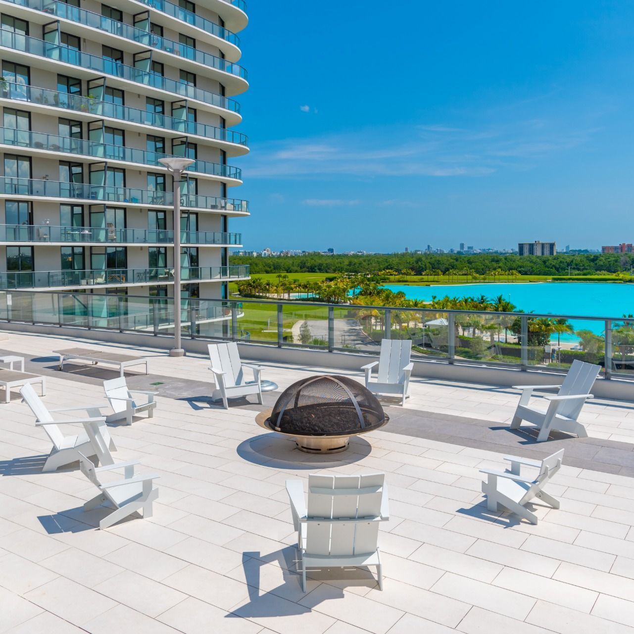 Swimming Pools Fire Pit at Shoreline at SoLe Mia with view of Lagoon