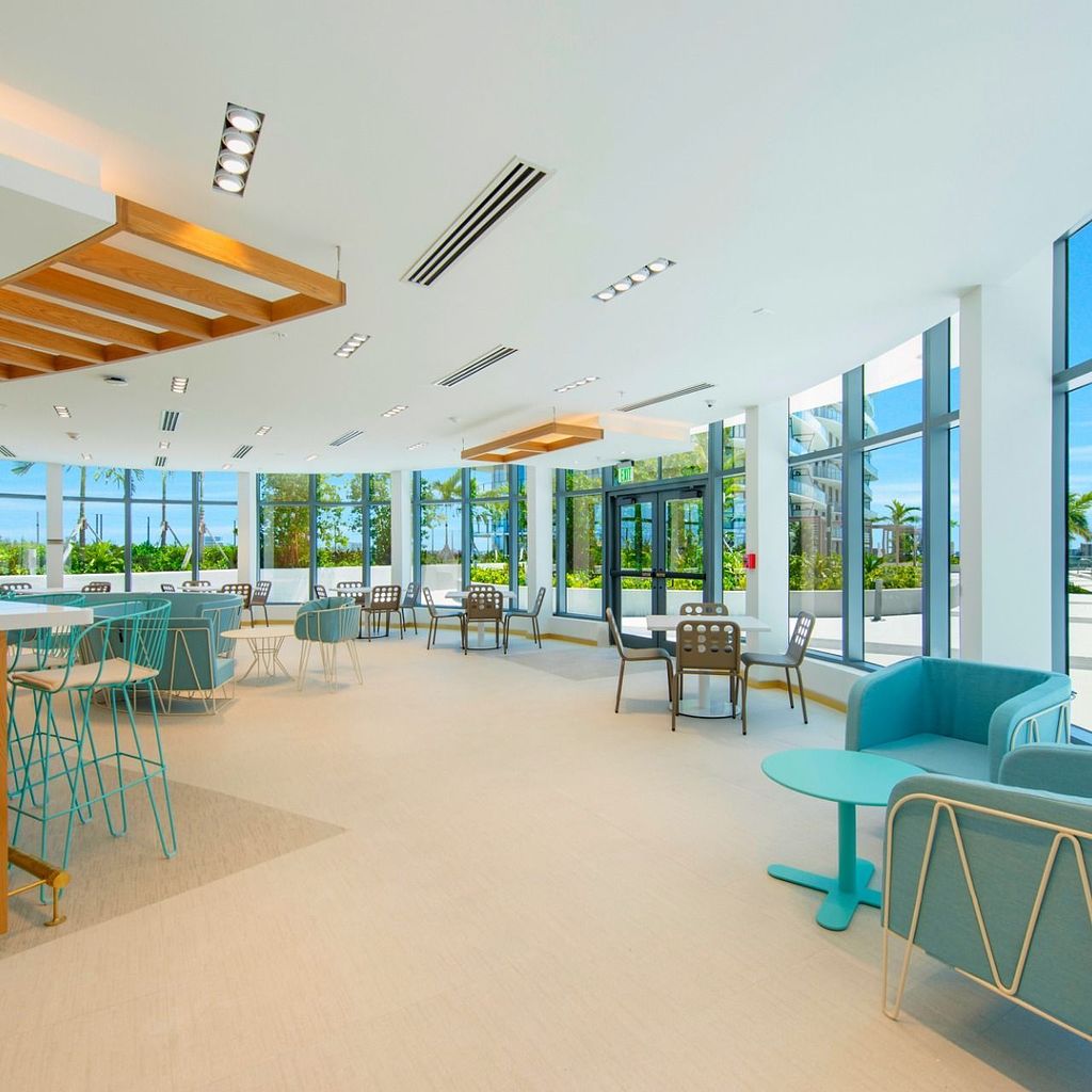 Resident Lounges Clubroom with View of the Outside Amenities at The Shoreline at SoLé Mia Apartments in North Miami