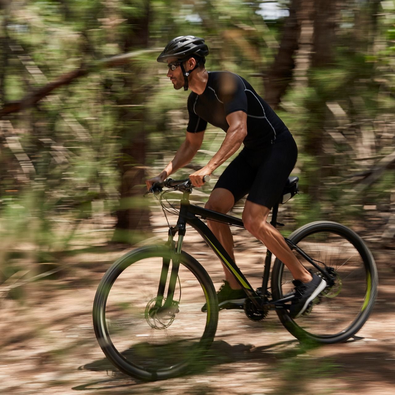 Parks & Beaches Guy Mountain Biking Through North Florida's Nature Trails near The Shoreline at Solé Mia Apartments