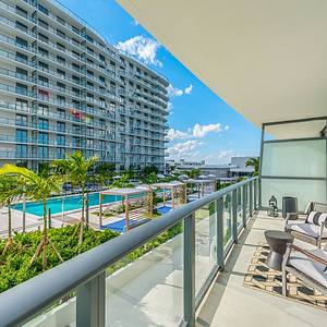 Balcony view of pool and cabanas