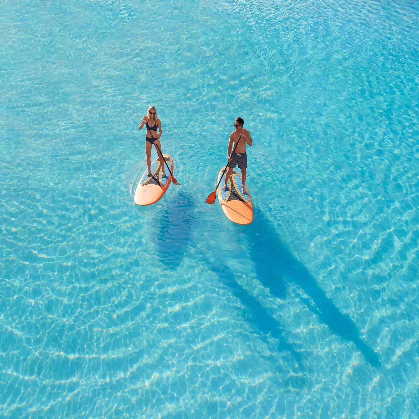 Parks & Beaches Couple Paddle-boarding on Laguna Solé near The Shoreline at Solé Mia Apartments in North Miami