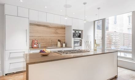 Kitchen with island, stainless steel appliances, and natural light